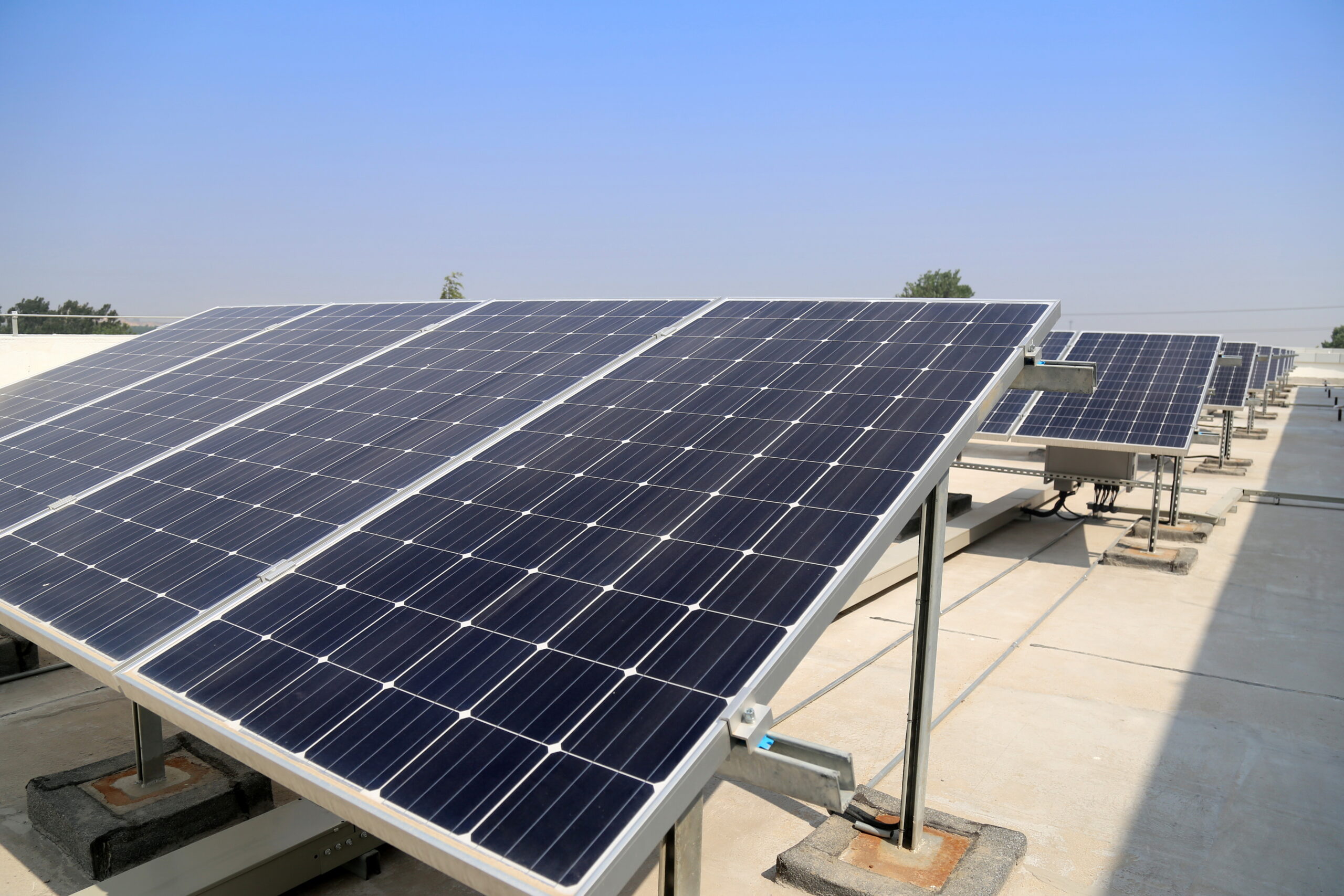 Tilted rooftop solar panel mounting system